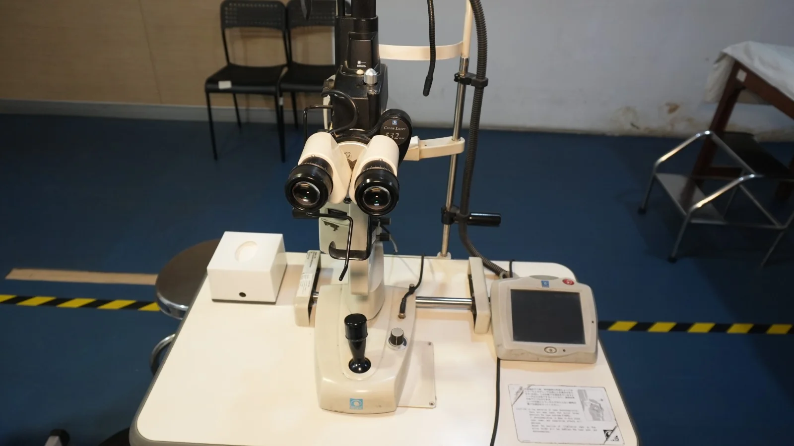Green laser delivery system mounted on a slit lamp, seen from above