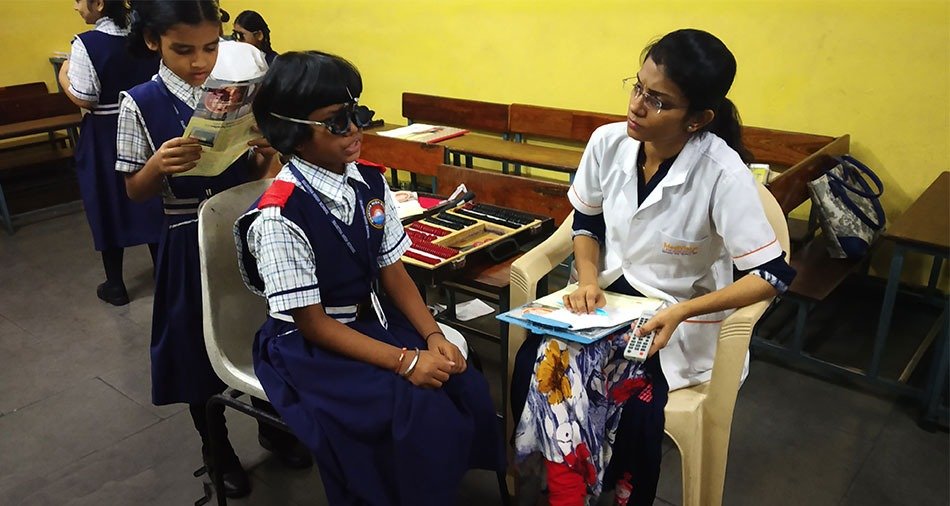 Camp volunteers registering patients for eye screening