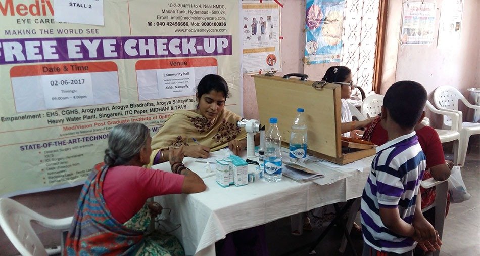 Schoolchildren having their eyes tested at a screening camp