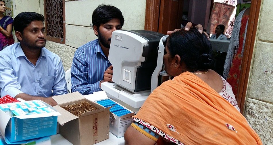 Spectacles being handed over at a community eye camp