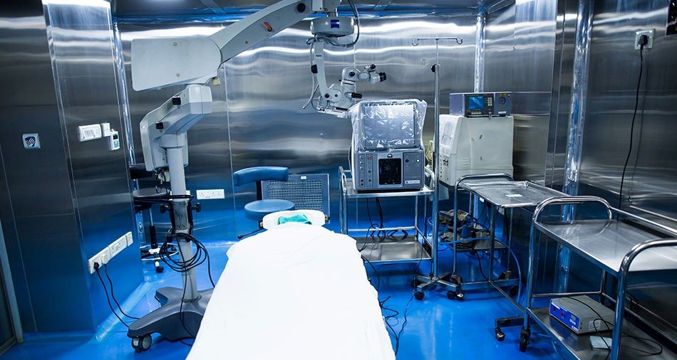 Operating microscope positioned over the surgical field