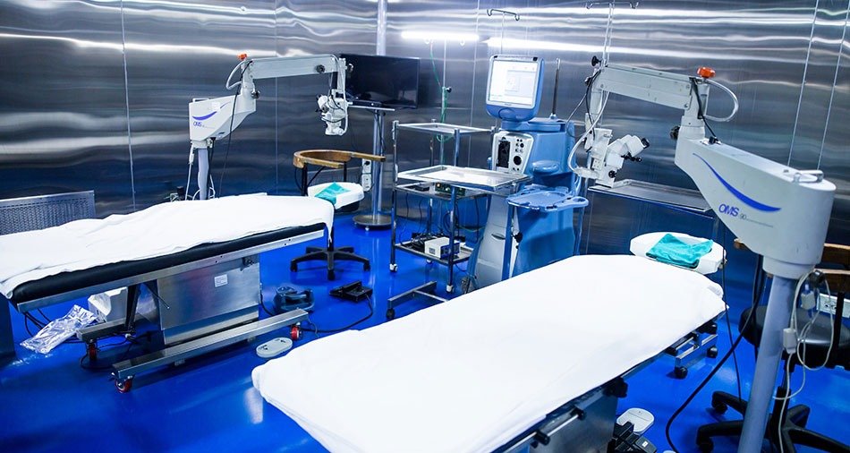In-patient room with a bed and seating for an attendant