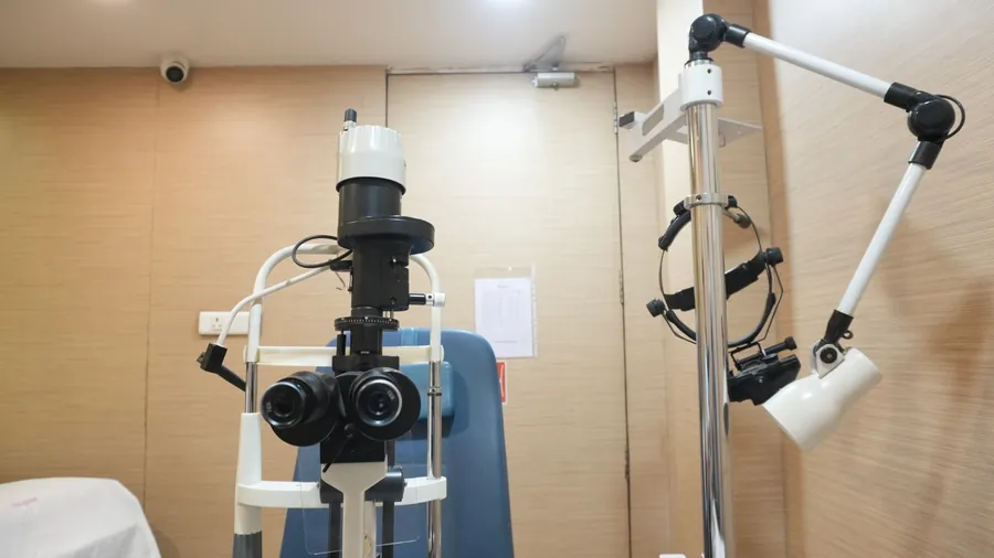 Close-up of a slit lamp showing its optics and joystick control